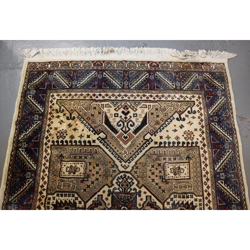 709 - Small middle eastern design cream and blue ground carpet, having geometric floral and foliate design... 