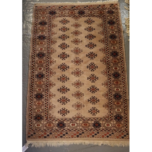 710 - Small beige ground middle eastern design runner, having central lozenge geometric decoration and flo... 