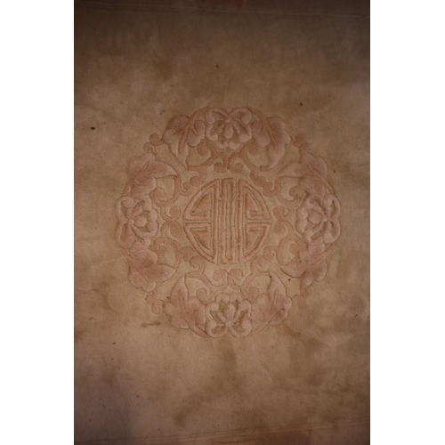 711 - Modern Chinese beige wash ground rug having foliate designs with Chinese symbols. 125 x 186 cm (B.P.... 