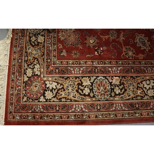 712 - Middle Eastern style red ground super Keshan carpet. 275 x 360cm approx. 
(B.P. 21% + VAT)