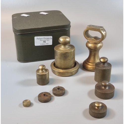 36 - Tin box of assorted brass weights.
(B.P. 21% + VAT)