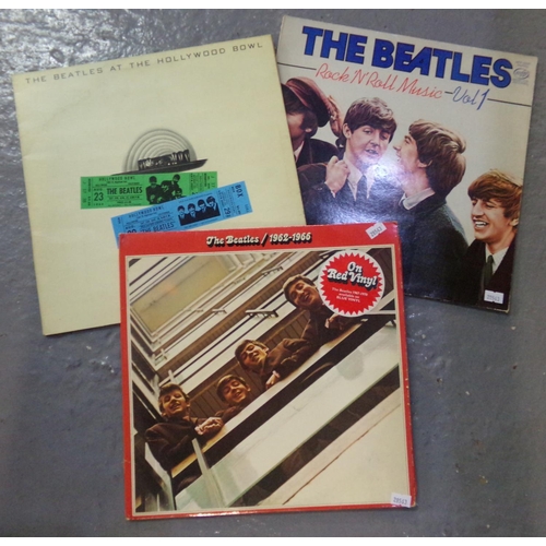 485 - Three vinyl LPs of The Beatles to include; 1962-66 double album on red vinyl, 'The Beatles at the Ho... 