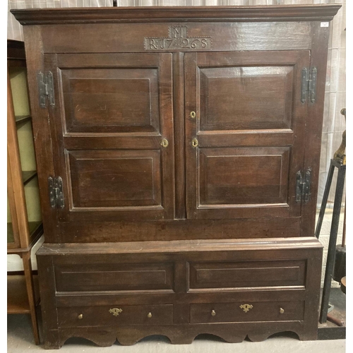 492 - 18th century oak two stage vestment cupboard, the moulded cornice above two blind panelled and field...