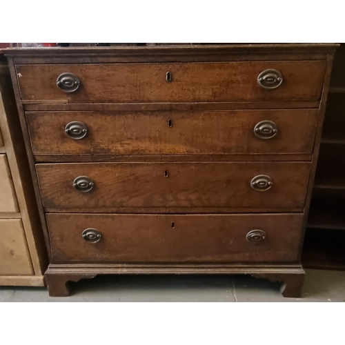 511 - 19th century oak straight front chest of four drawers on a projecting base and bracket feet.  86x45x... 