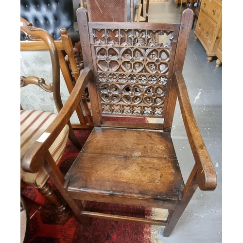 556 - 19th century oak farmhouse open armchair, the back with pierced foliate decoration.  (B.P. 21% + VAT... 