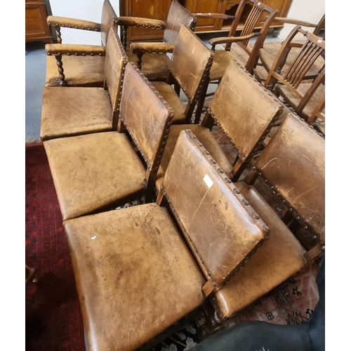 559 - Set of eight oak and leather Cromwellian style dining chairs, having bobbin turned supports.  (6+2) ... 