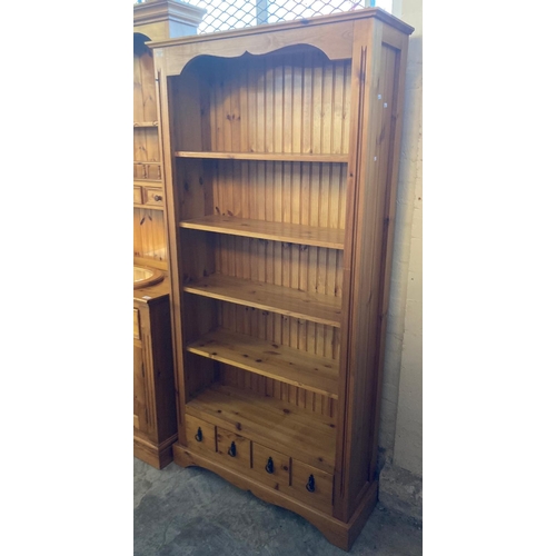 617 - Modern natural pine open bookshelves, four fitted shelves with a row of short drawers to the base.  ... 