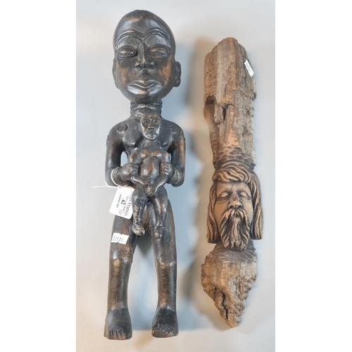 62 - Tribal art - carved hardwood figurine of a nude woman holding child. Together with a driftwood mask ... 