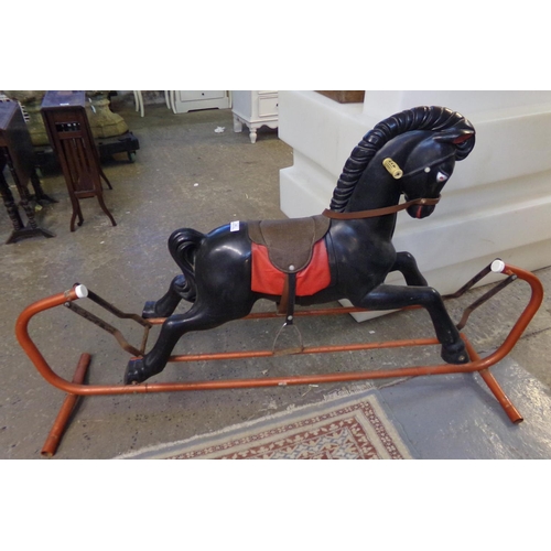 630 - Large plastic rocking horse on tubular metal swing frame.  (B.P. 21% + VAT)