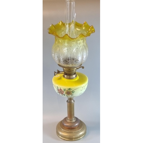 82A - Early 20th Century double oil burner lamp, having yellow frilled and etched glass shade, above a yel... 