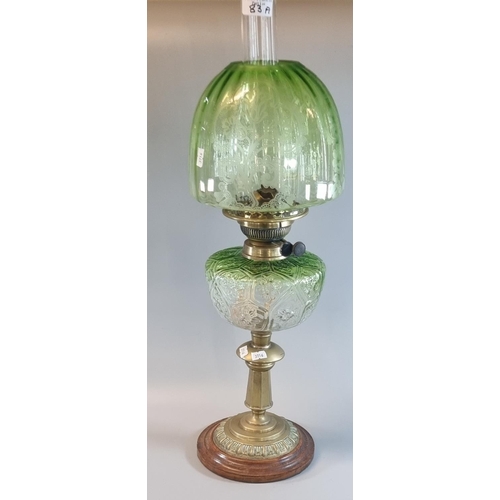 83A - Early 20th Century double oil burner lamp, having green glass etched foliate shade above a green gla... 