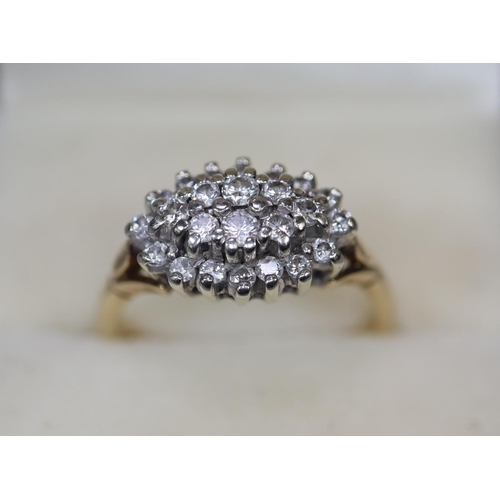 244 - 9ct gold boat shaped diamond cluster ring. 4 grams approx. 
Ring size N.
(B.P. 21% + VAT)