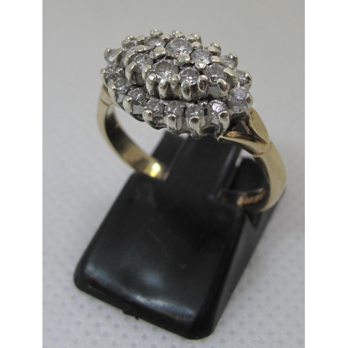 244 - 9ct gold boat shaped diamond cluster ring. 4 grams approx. 
Ring size N.
(B.P. 21% + VAT)