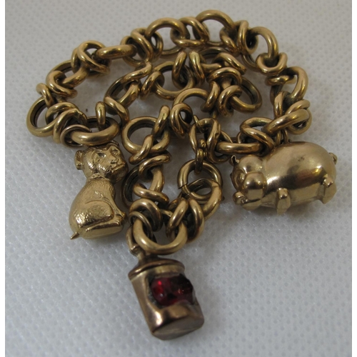 245 - Unmarked yellow metal charm bracelet with three 9ct gold animal and lantern charms. 13.5g approx. 
(... 