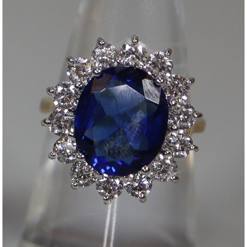 258 - A synthetic sapphire and moissanite ring set in gold plated silver. 
(B.P. 21% + VAT)