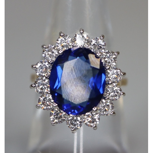 258 - A synthetic sapphire and moissanite ring set in gold plated silver. 
(B.P. 21% + VAT)