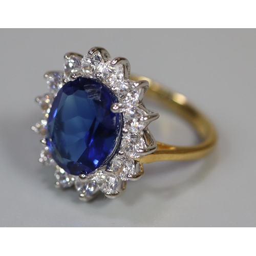 258 - A synthetic sapphire and moissanite ring set in gold plated silver. 
(B.P. 21% + VAT)