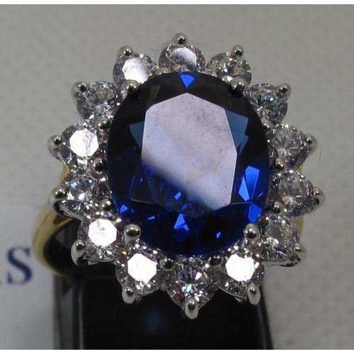 258 - A synthetic sapphire and moissanite ring set in gold plated silver. 
(B.P. 21% + VAT)