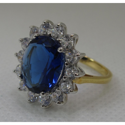 258 - A synthetic sapphire and moissanite ring set in gold plated silver. 
(B.P. 21% + VAT)