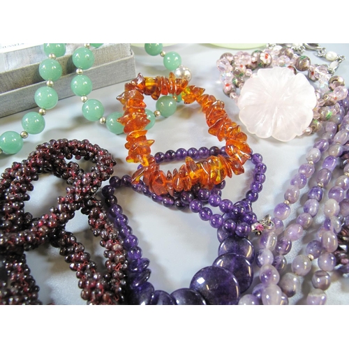 292 - Bag containing assorted bangles, beaded necklaces, gemstone beads etc.   (B.P. 21% + VAT)