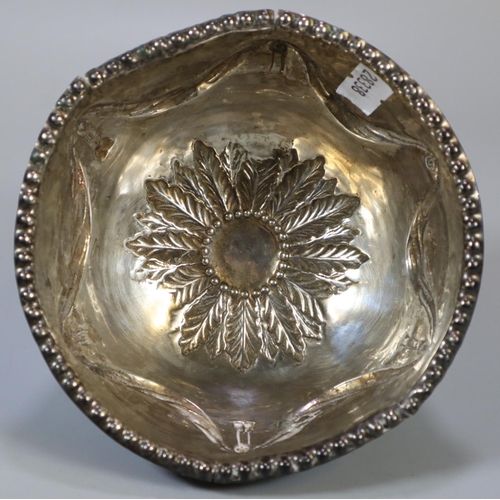 221 - 19th century silver bowl, overall with repoussé swags and foliage, standing on three lion mask mount... 