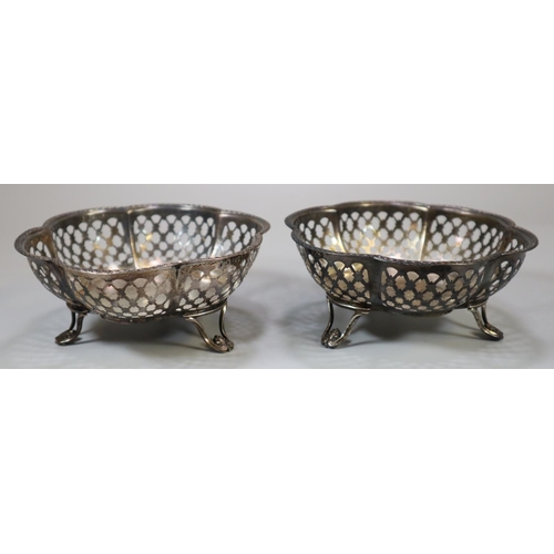 222 - Pair of silver bonbon dishes with pierced decoration standing on three stylised feet.  Chester hallm... 