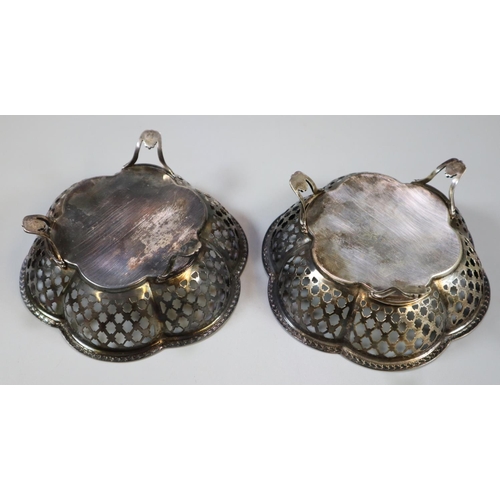 222 - Pair of silver bonbon dishes with pierced decoration standing on three stylised feet.  Chester hallm... 