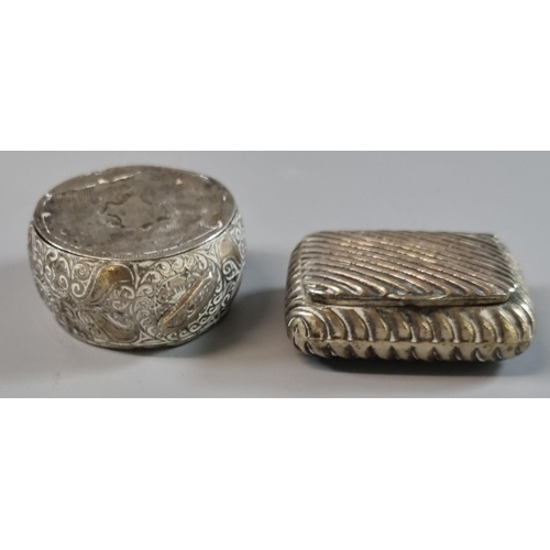 229 - White metal wrythen design cushion shaped snuff box together with another possibly Indian circular b... 