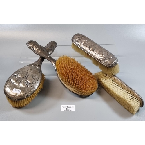 234 - Two Art Nouveau silver vanity dressing table brushes, together with two other similar hair brushes i... 