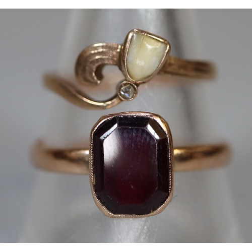 237 - 9ct gold red stone ring together with a yellow metal ring set with a baby's tooth.  Ring size W&1/2 ... 