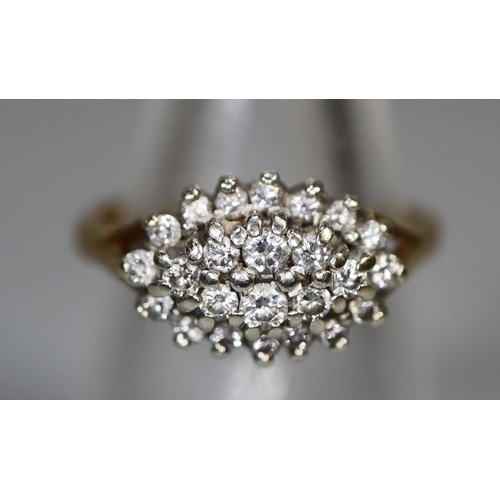 244 - 9ct gold boat shaped diamond cluster ring. 4 grams approx. 
Ring size N.
(B.P. 21% + VAT)