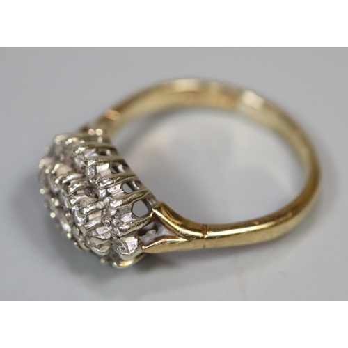 244 - 9ct gold boat shaped diamond cluster ring. 4 grams approx. 
Ring size N.
(B.P. 21% + VAT)