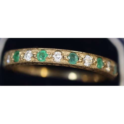 247 - A 9ct gold half eternity style ring set with green and white stones.  Ring size N.  Approx weight 1.... 