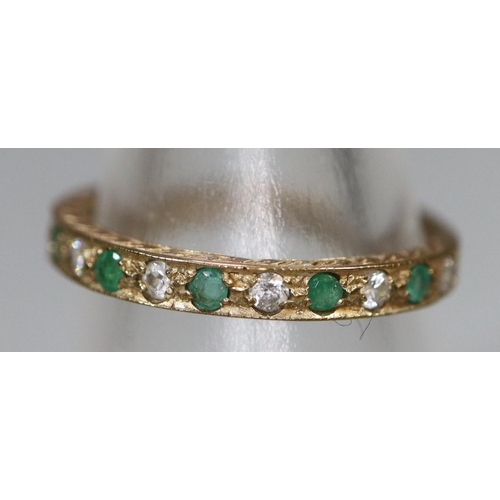 247 - A 9ct gold half eternity style ring set with green and white stones.  Ring size N.  Approx weight 1.... 