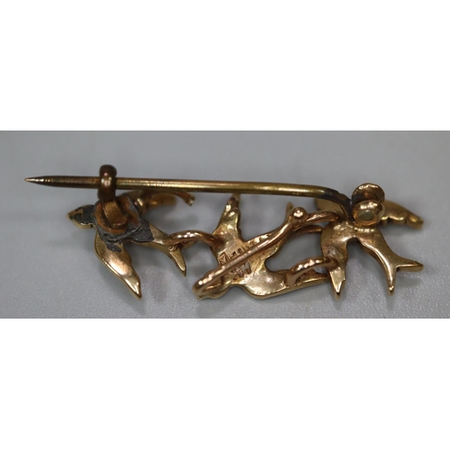 255 - A yellow metal triple swallow brooch set with seed pearls.
Approx weight 2.3 grams.
(B.P. 21% + VAT)