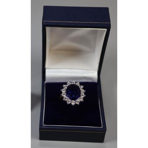 258 - A synthetic sapphire and moissanite ring set in gold plated silver. 
(B.P. 21% + VAT)