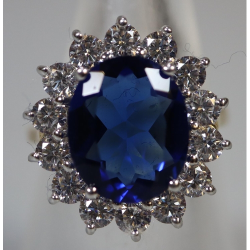 258 - A synthetic sapphire and moissanite ring set in gold plated silver. 
(B.P. 21% + VAT)