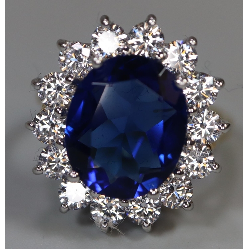 258 - A synthetic sapphire and moissanite ring set in gold plated silver. 
(B.P. 21% + VAT)