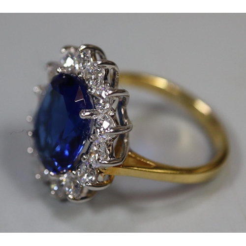 258 - A synthetic sapphire and moissanite ring set in gold plated silver. 
(B.P. 21% + VAT)