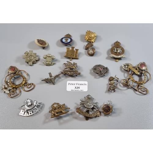 325 - Small collection of British Military cap badges, to include: The Buffs, Fishguard Yeomanry (possibly... 