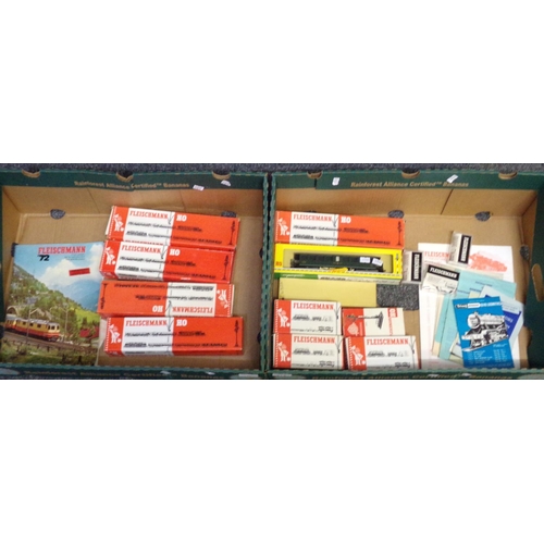 335 - Two boxes of Fleishmann HO scale items, all in original boxes, to include: various carriages, manual... 