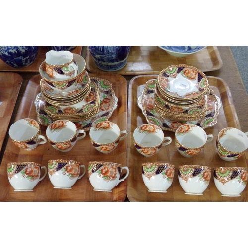 354 - Two trays of English fine bone china part teaware in Imari colours, similar to the 'Heirloom' patter... 