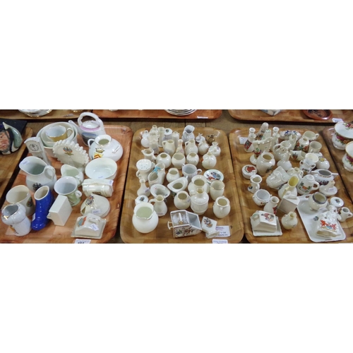 382 - Three trays of crested ware souvenir items to include: pigs, urns, vases, top hat, miniature cheese ... 