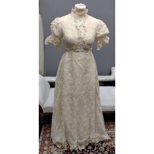 402 - Vintage designer florally embroidered wedding dress (probably 1970's), with cap sleeves, high neck a...