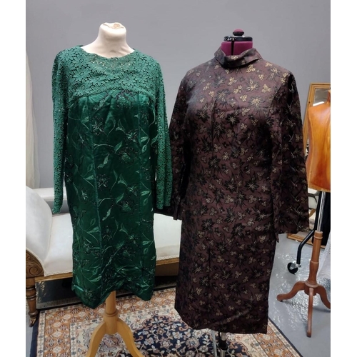 411 - Two 1960's brocade long sleeved shift dresses; one in green with floral pattern, stripes down the fr... 