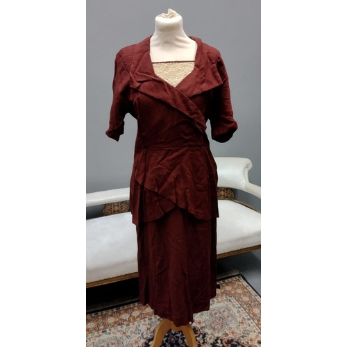 414 - Two vintage 1940's burgundy colour day dresses; one with bow and button detail down the front, the o... 