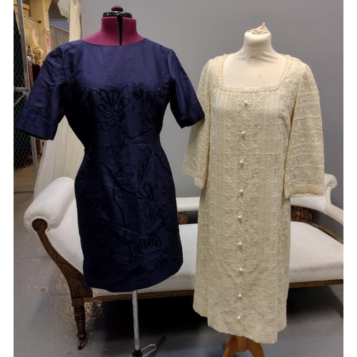 431 - Two 1960's sleeved shift dresses; one blue with short sleeves and ribbon embroidery and a cream long... 