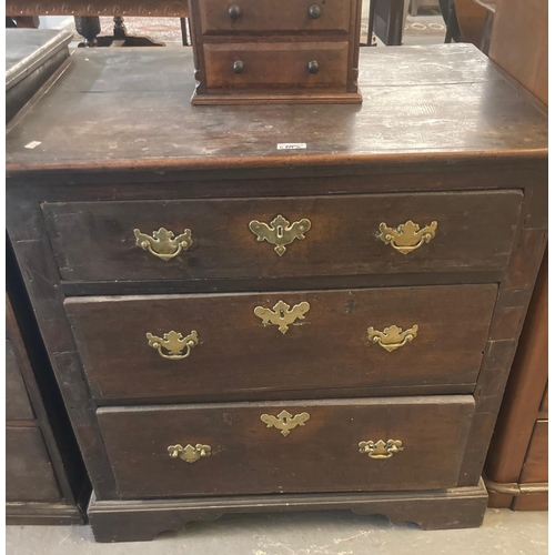 469A - 18th century oak straight front chest of three drawers on a projecting base and bracket feet.  81x58... 