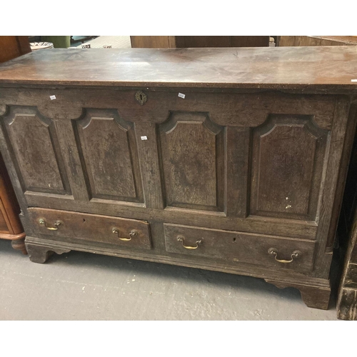 473 - 18th century Welsh oak coffer, the moulded top above four fielded panels, two fitted drawers on a pr... 