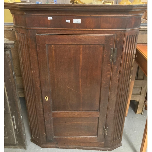 485 - 19th century ok single door blind panelled hanging corner cupboard, the interior revealing shaped sh... 